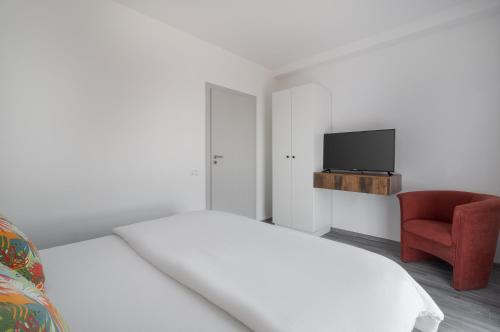 Ένα ή περισσότερα κρεβάτια σε δωμάτιο στο Golden Hour Apartment