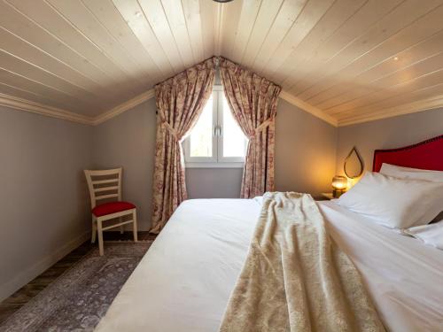 a bedroom with a large bed and a window at Nafsika Suites in Nea Moudania