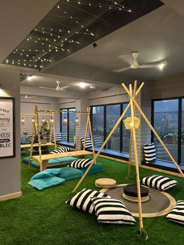 a room with a bunch of pillows on the floor at FF21- Pods in Bengaluru