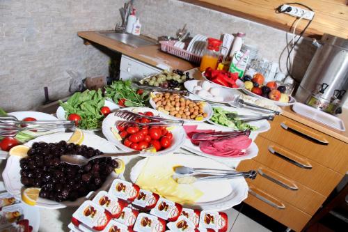 a table full of plates of food on a counter at garden hill hotel in Istanbul