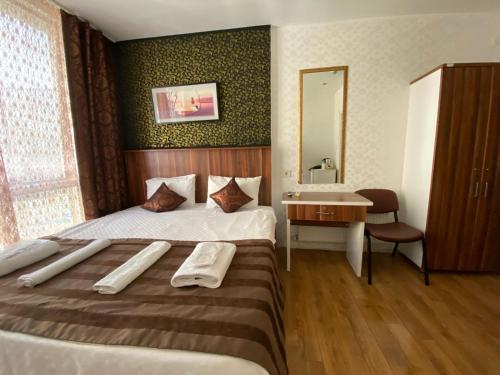 a hotel room with a bed and a sink at garden hill hotel in Istanbul