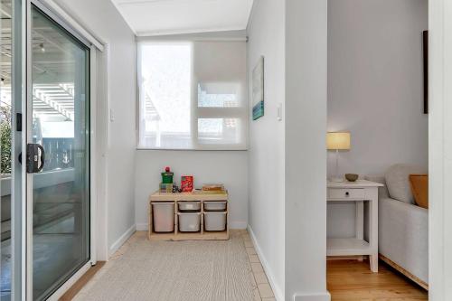 a hallway with a door leading into a room at Christies Grove - Seaside Bliss near McLaren Vale in Christies Beach