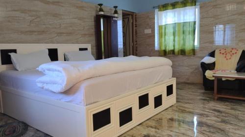 Postel nebo postele na pokoji v ubytování Okaasan Guest House