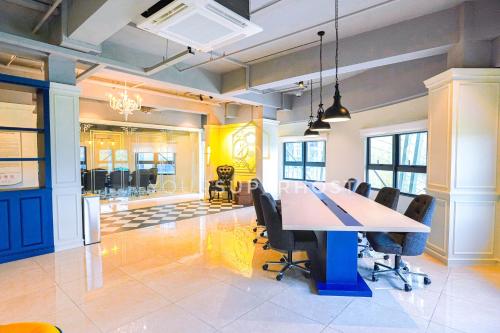 a conference room with a table and chairs at Paxtonz by YourSuperhost in Kuala Lumpur