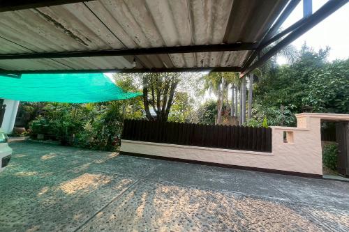 a patio of a house with a fence at The Royal Shilton Resort in Chiang Mai