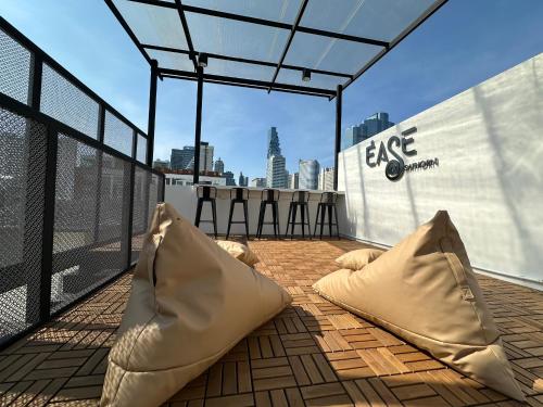 a pair of pillows on the roof of a building at Ease at Sathorn Hostel and Coworking Space in Bangkok