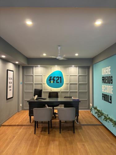 an office with a table and chairs in a room at FF21- Pods in Bengaluru