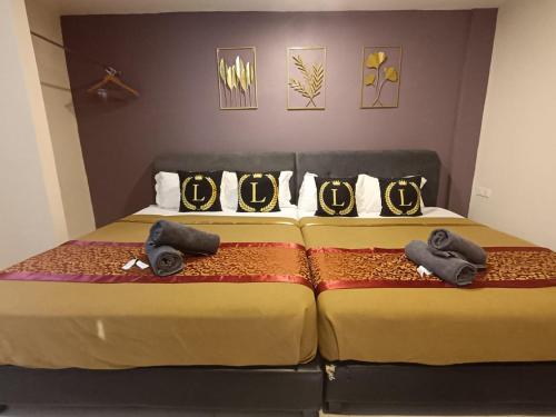 Ένα ή περισσότερα κρεβάτια σε δωμάτιο στο L Ferringhi Hotel