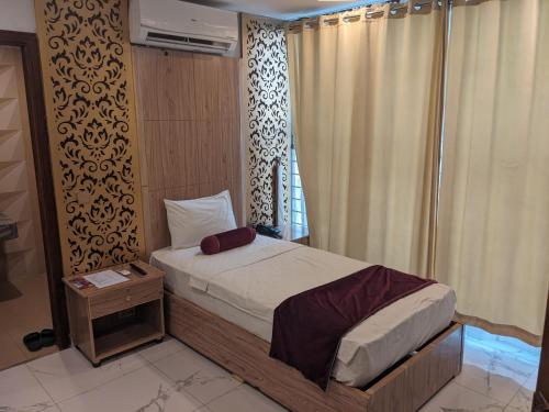 Кровать или кровати в номере Nuva Hotel