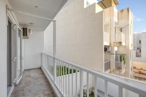 a balcony of a house with white walls at Luxury Central Malta Apartment Brand New by SF Homes in Qormi