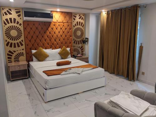 Кровать или кровати в номере Nuva Hotel
