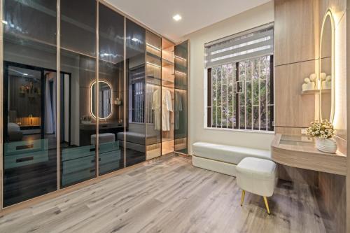 a bathroom with a tub and a sink and a window at Khánh Villa Phan Tôn Venue stay in Da Nang
