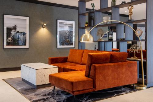 a living room with a couch and a table at Clybaun Hotel in Galway