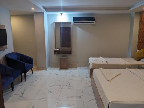 Кровать или кровати в номере Nuva Hotel