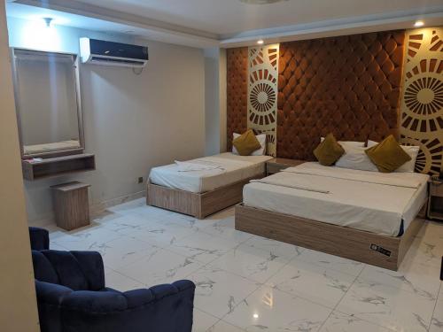 Кровать или кровати в номере Nuva Hotel