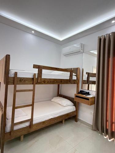 a room with two bunk beds in a room at Villa Papa-Berat in Berat