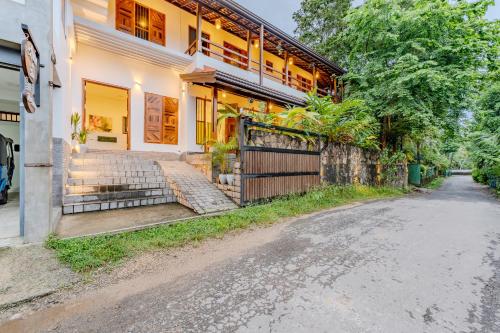 an empty street in front of a house at Artisan By Sebu in Galle