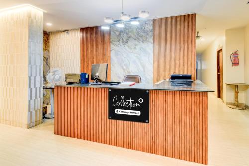 a restaurant with a counter with a sign on it at Super Collection O Isckon Temple Formerly Sri Varaahi Inn in Hyderabad