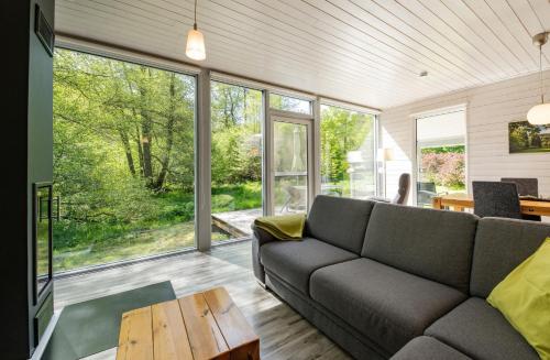 a living room with a couch and a table at 2 Personen mit Sauna F0H5 in Ruhla