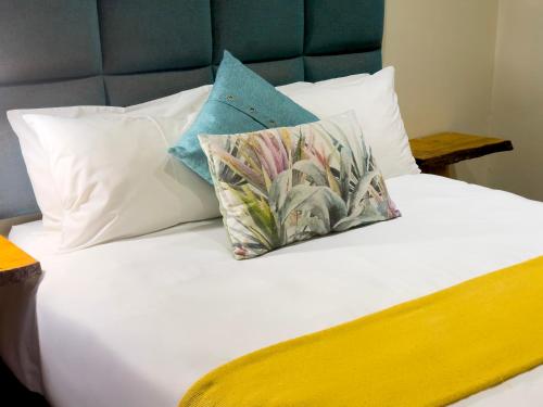 Ένα ή περισσότερα κρεβάτια σε δωμάτιο στο Centurion Guest House and Lodge
