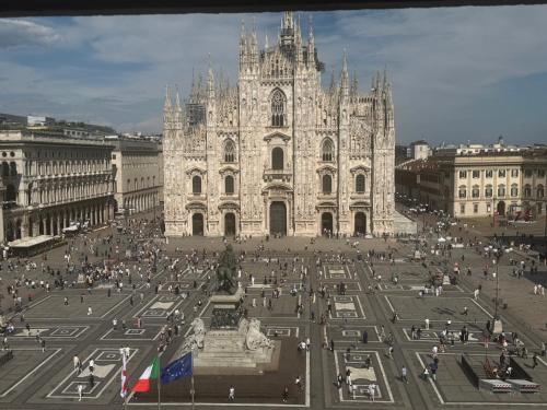 a large cathedral with a square in front of it at Flat in Duomo in Milan