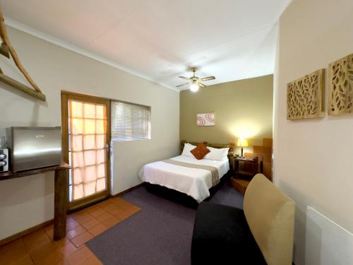 Ένα ή περισσότερα κρεβάτια σε δωμάτιο στο Centurion Guest House and Lodge