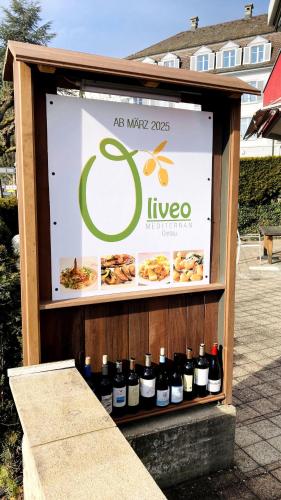 a display of wine bottles on a stand at Organic BnB Froschkoenig Gersau in Gersau