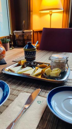 a table with a plate of food on a table at Organic BnB Froschknig Dorfplatz in Gersau