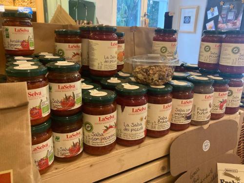 a bunch of jars of jam sitting on a shelf at Organic BnB Froschkoenig Chaiserstock in Gersau
