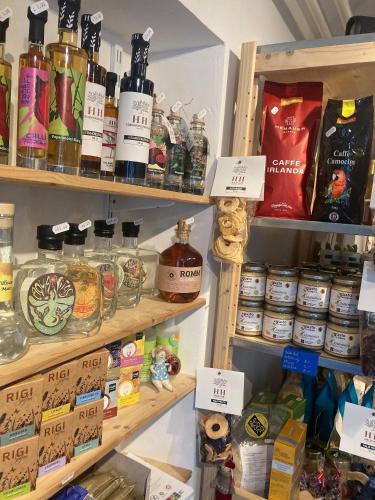 a store shelf with many different types of products at Organic BnB Froschknig Dorfplatz in Gersau