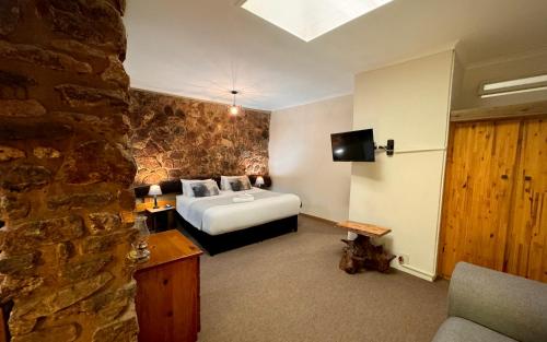 Ένα ή περισσότερα κρεβάτια σε δωμάτιο στο Centurion Guest House and Lodge