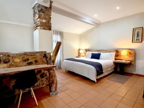 Ένα ή περισσότερα κρεβάτια σε δωμάτιο στο Centurion Guest House and Lodge