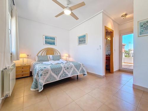 a bedroom with a bed and a ceiling fan at Mar Menor Golf Villa - 6310 in Torre-Pacheco