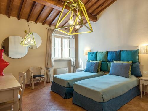 a living room with two beds and a couch at Resort Casale Le Torri in Ponsacco