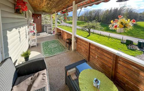 an outdoor patio with a view of a yard at Pet Friendly Home In Söderköping in Söderköping
