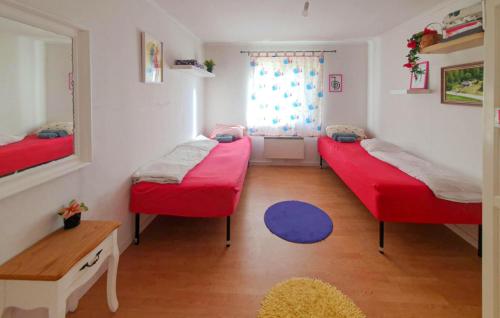 a room with two beds and a window at Pet Friendly Home In Söderköping in Söderköping