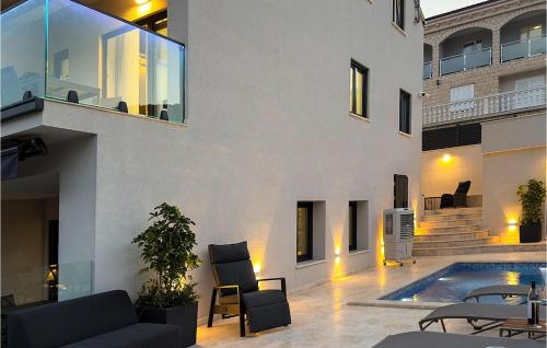 a house with a swimming pool next to a building at Awesome Apartment In Korcula With Sauna in Korčula