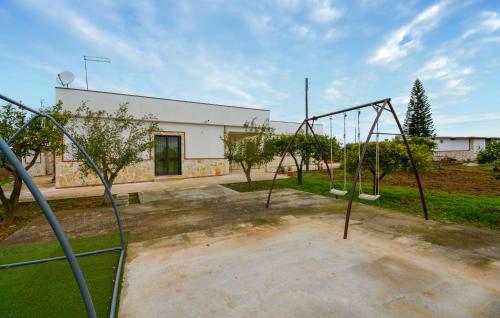 an empty park with an empty swing set at Gorgeous Home In Acate in Acate