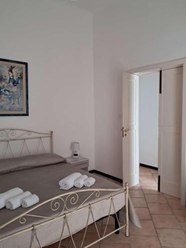a bedroom with a bed with towels on it at B&B Manzoni 2 in Neviano