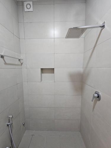 a bathroom with a shower with a glass door at Star Room's in Durrës