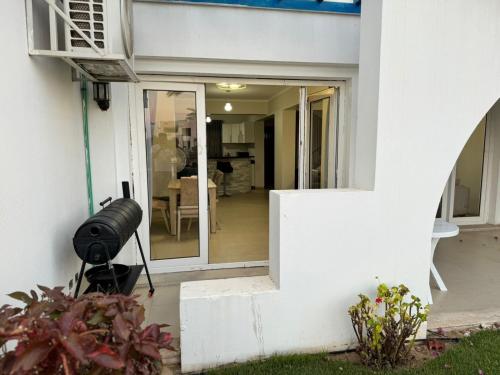 a door leading into a home with a patio at Townhouse in Ras Elhekma