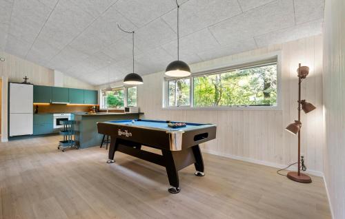 a living room with a pool table in it at 4 Bedroom Gorgeous Home In Oksbøl in Oksbøl
