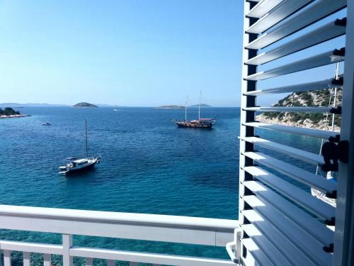 a view of the ocean from a building at Apartments Uvala Murtar in Jezera