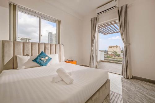 Ένα ή περισσότερα κρεβάτια σε δωμάτιο στο Khanh Villa Phuoc Truong 2 - Venuestay