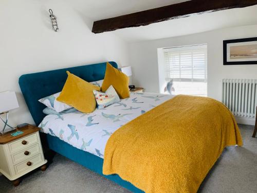 En eller flere senge i et værelse på Cockle Bay Cottage