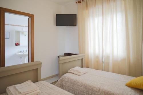 Ένα ή περισσότερα κρεβάτια σε δωμάτιο στο Agriturismo Podere Acqualoreto