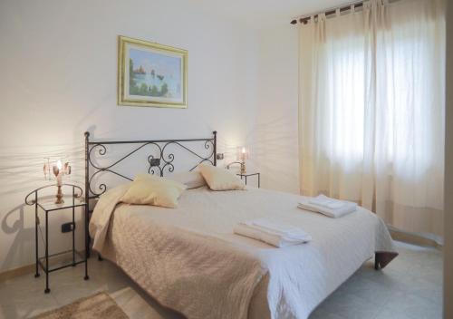 Ένα ή περισσότερα κρεβάτια σε δωμάτιο στο Agriturismo Podere Acqualoreto