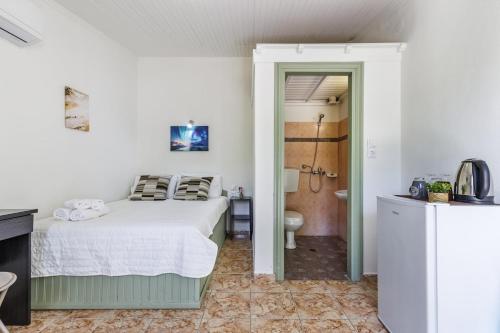 Postel nebo postele na pokoji v ubytování Lemon Trees Rooms II