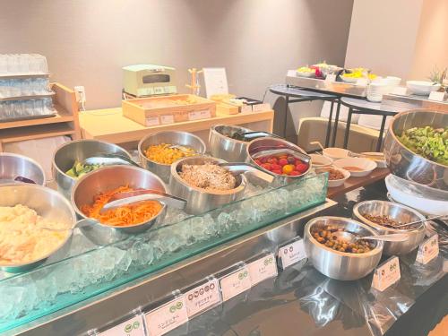 a buffet line with many different types of food at Tokyu Vacations Fujisan Mishima in Mishima