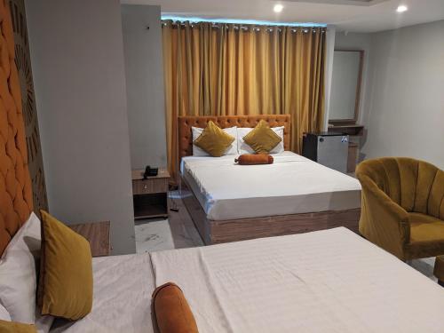 Кровать или кровати в номере Nuva Hotel